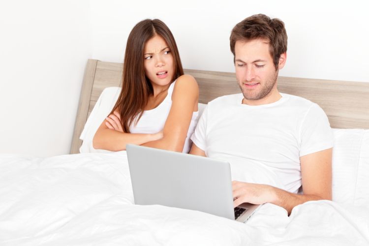 Royalty-Free Stock Photo Couple with laptop in bed.